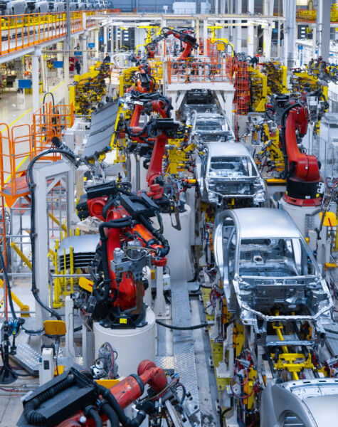 Assembly line production of new car. Automated welding of car body on production line. robotic arm on car production line is working